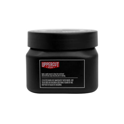 Pot de crème à raser Uppercut Deluxe, noir avec étiquette rouge et blanche, vue de face