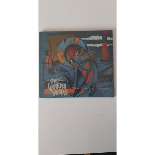 CD No Closer To Heaven de The Wonder Years — pochette illustrée par Michael Cortada, figure cubiste bleu et rouge, Hopeless Records 2015